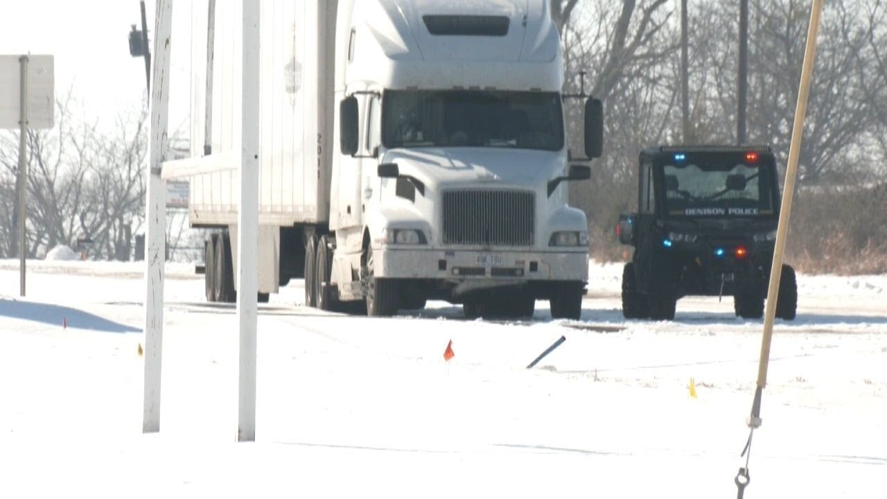 Big rigs stuck on icy Denison highway
