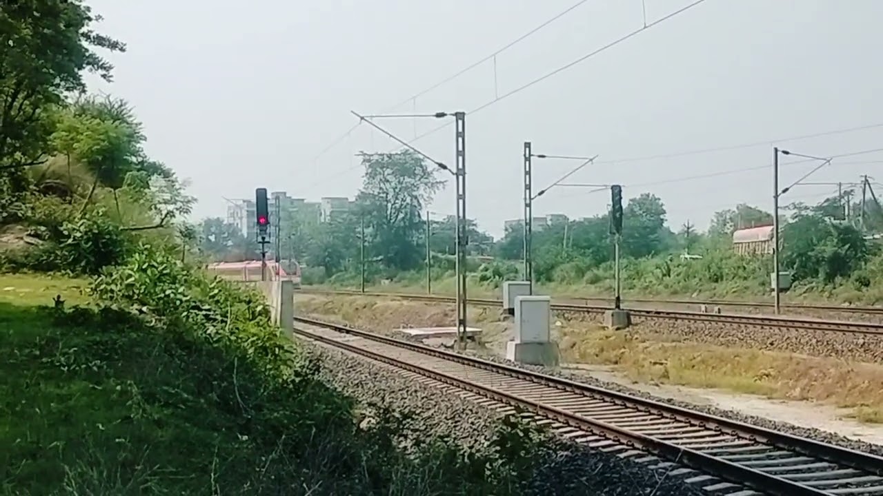 [20871 HOWRAH VANDA BHARAT EXPRESS DEPARTING GHATSHILA STATION WITH FULL SPEED MODE.]