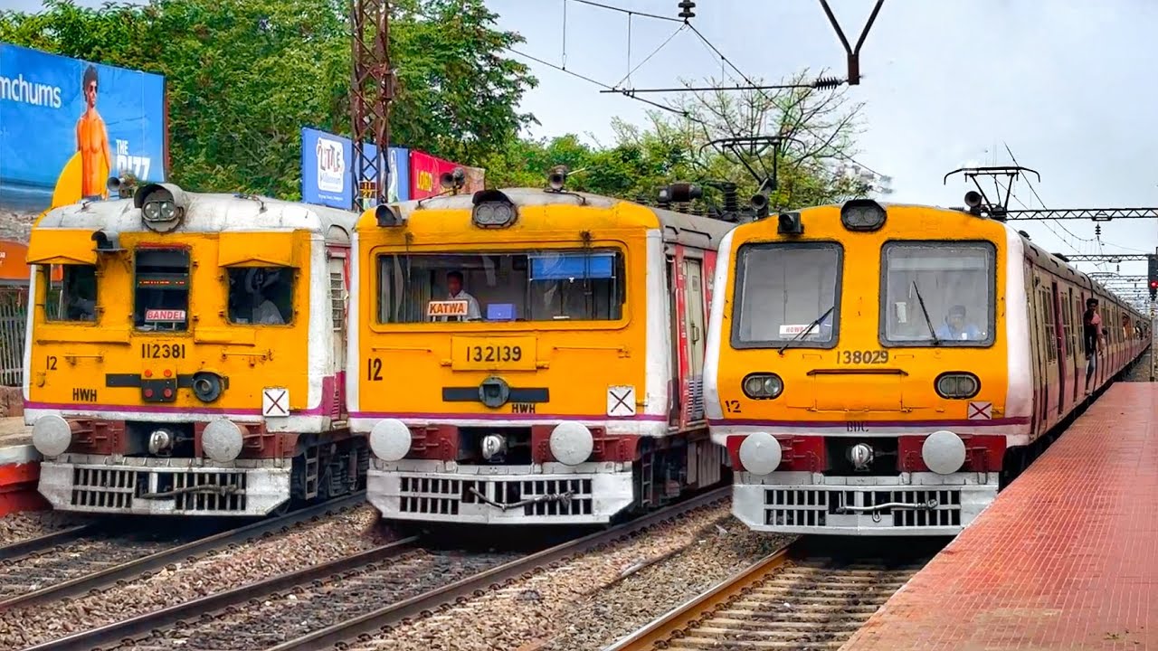 Different types of Indian local trains crossing action filmed at HIND MOTOR railway station.