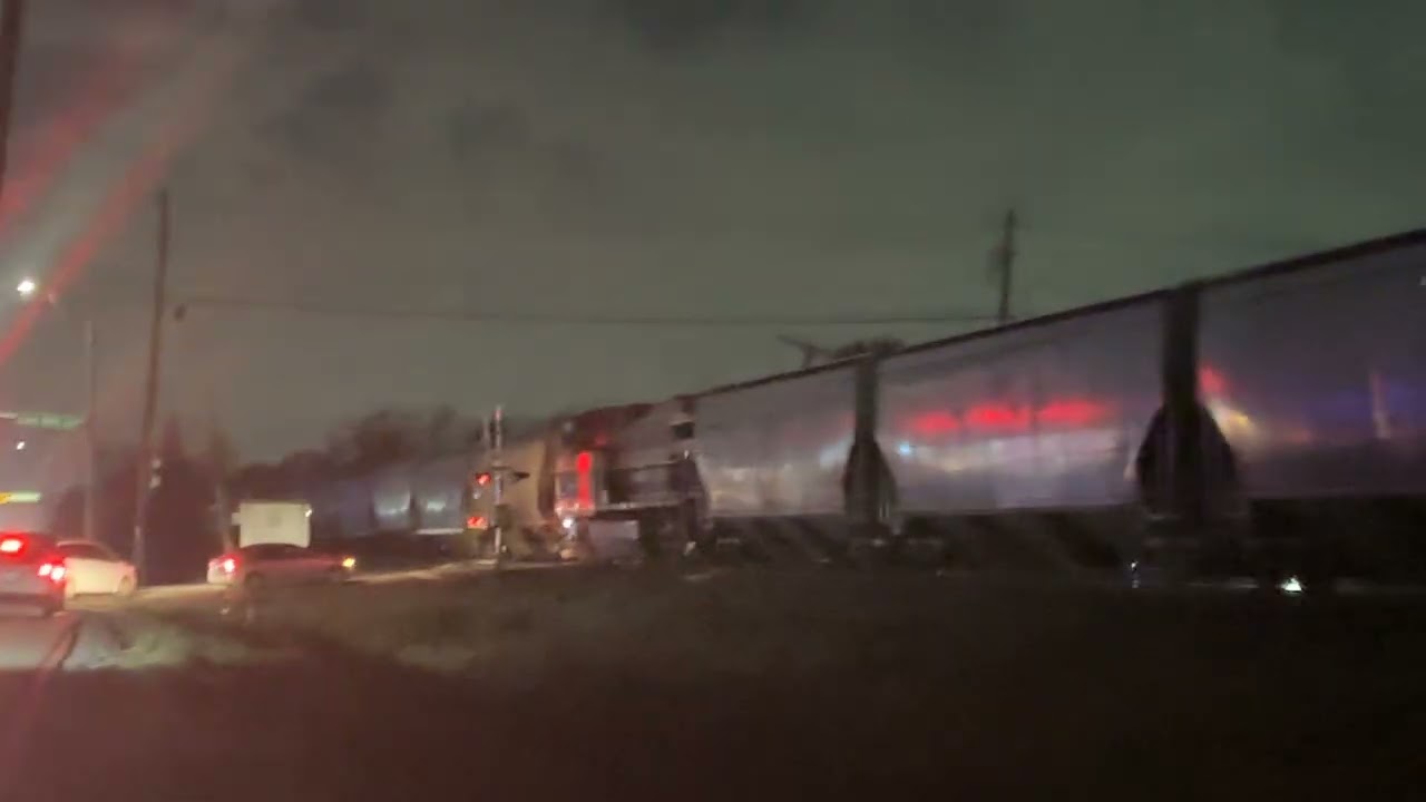 CP 8841 leads a fast grain train with a mid and rear Dpu and with a K5LAin Houston Texas!!!
