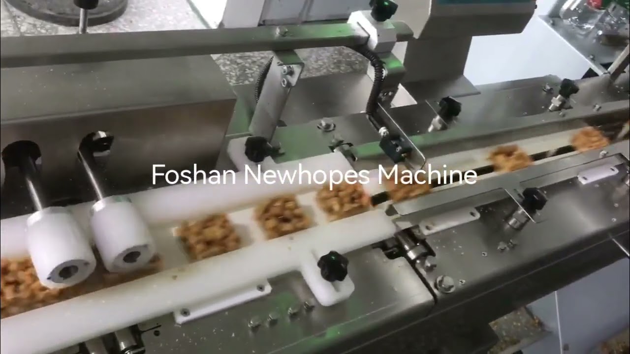High speed flow wrapper for snack (automatic infeed)