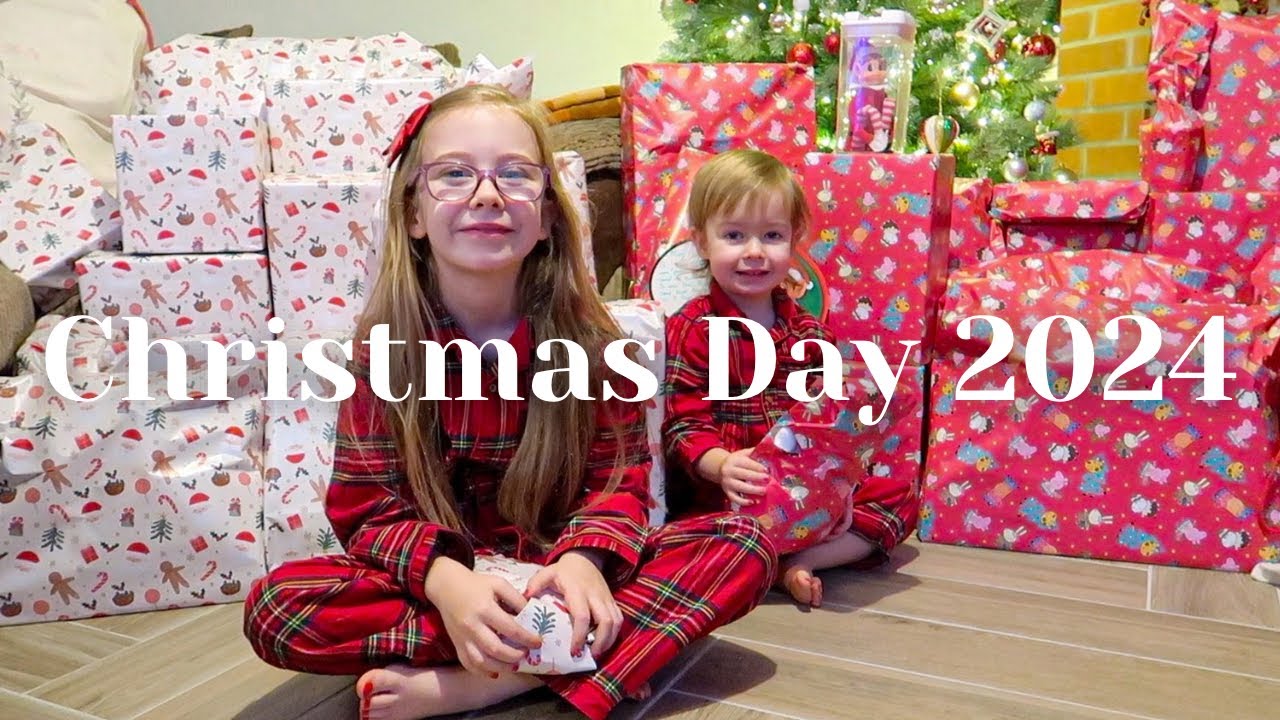 Christmas morning opening presents with our girls 2024