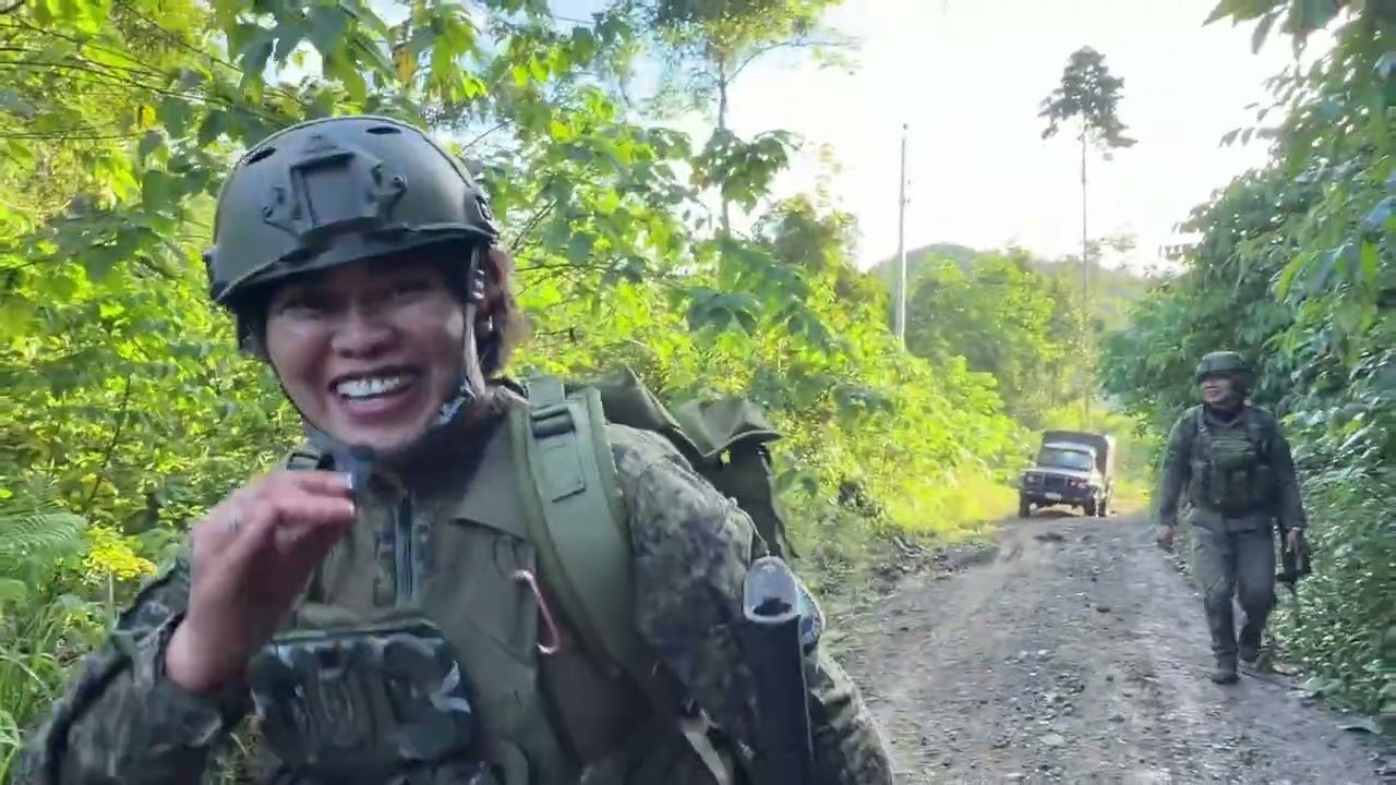 Female warrior ng 23IB, Cpl Joan Abo-abo, hiking to guerrilla base.