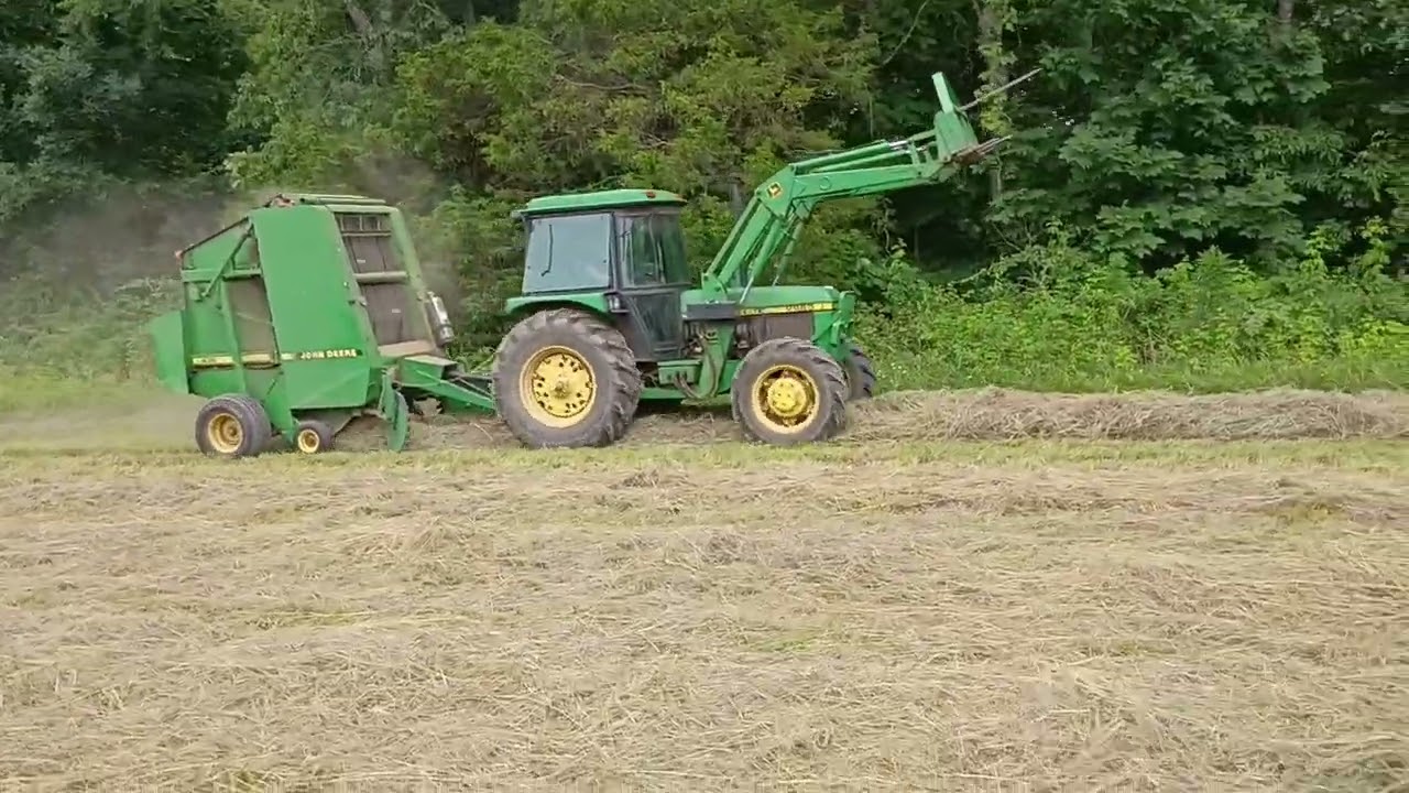 My boss Dave bailing hay