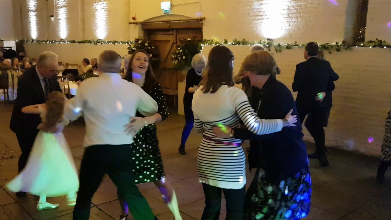 A waltz at a wedding barn dance