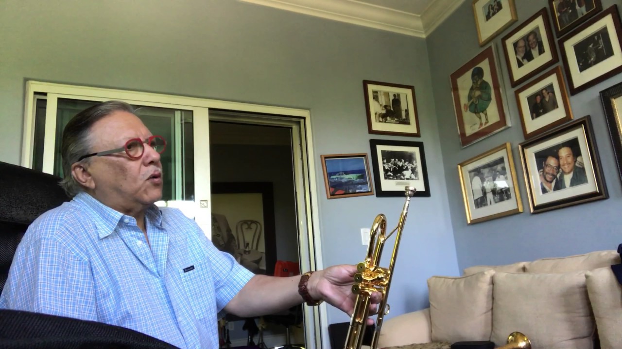 Arturo Sandoval taking delivery of his new horn.