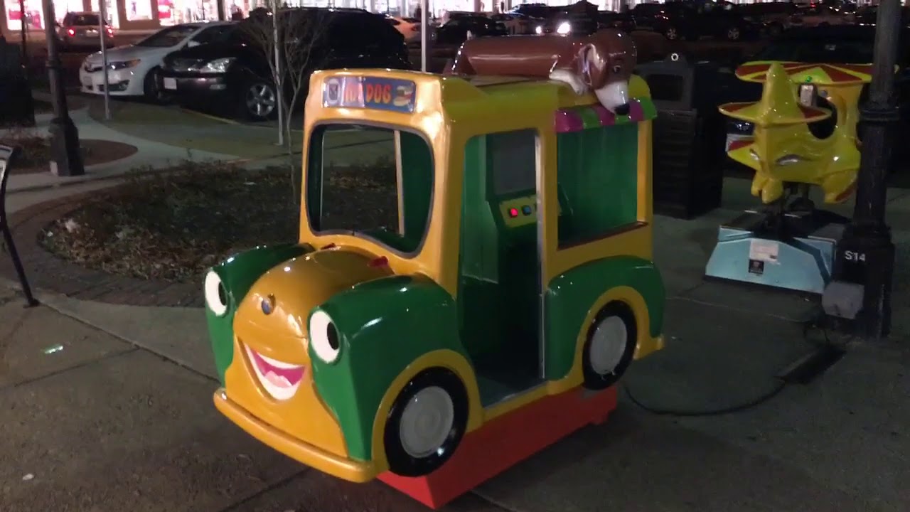 Riding a toy Hot Dog Truck.
