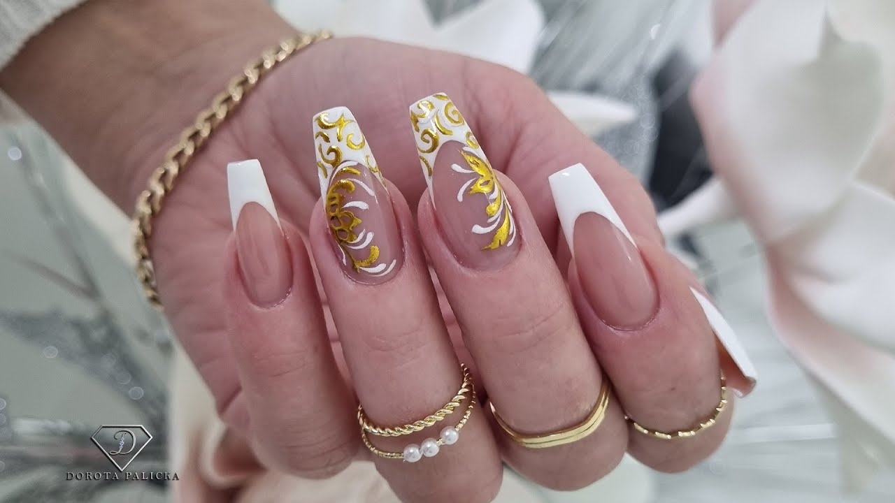 White and gold embossed nail art. Filigree nail art design. Fremch manicure