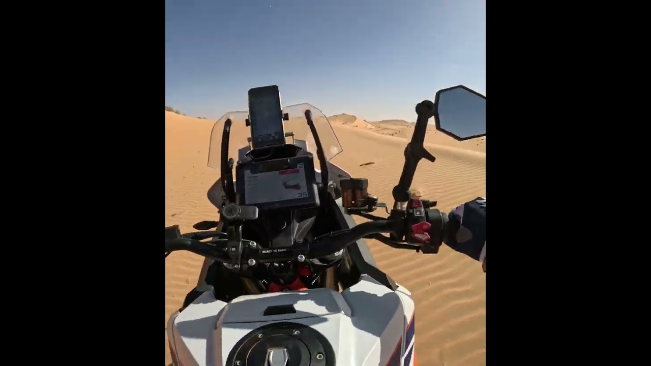 KTM 1290 following Tenere 700, desert offroad riding Dubai dunes .