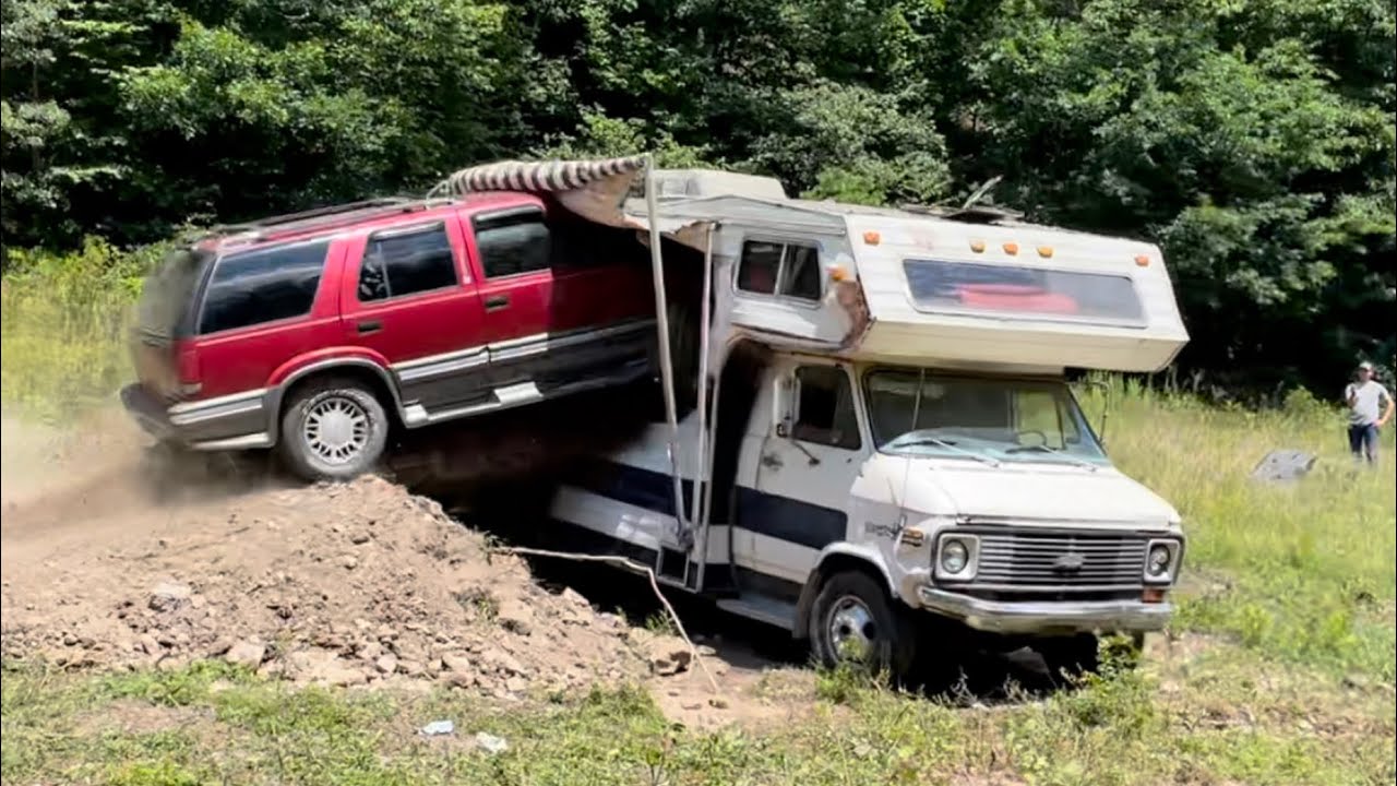 Driving A GMC Jimmy Through A Camper