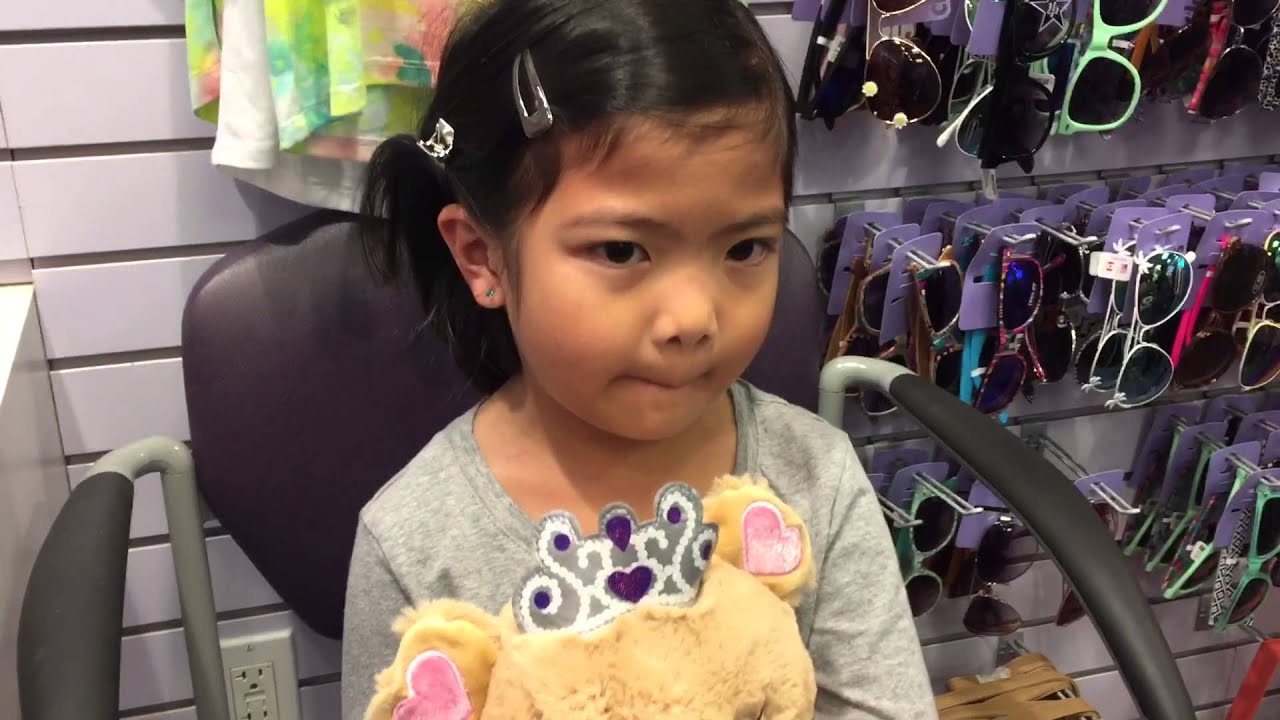 Brave girl getting ear piercings at claire's (5 years old)