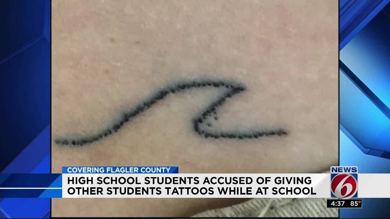 Student gets stick and poke tattoo at school