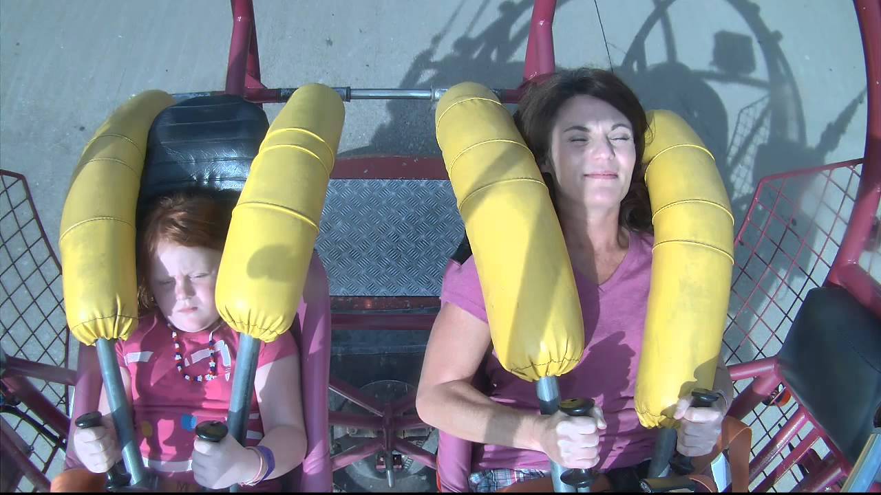 Abby and Sabrina riding the sling shot at King's Island