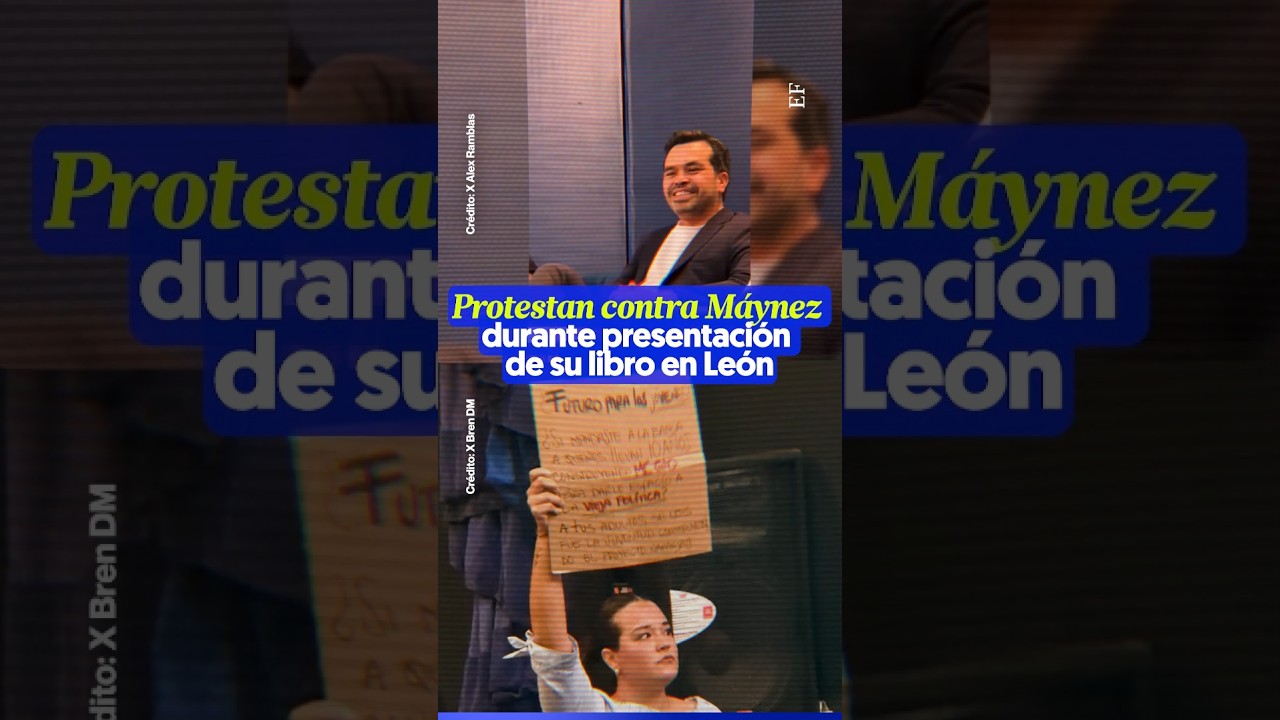 Militante de MC PROTESTA contra M&Aacute;YNEZ durante presentaci&oacute;n de su libro en Le&oacute;n
