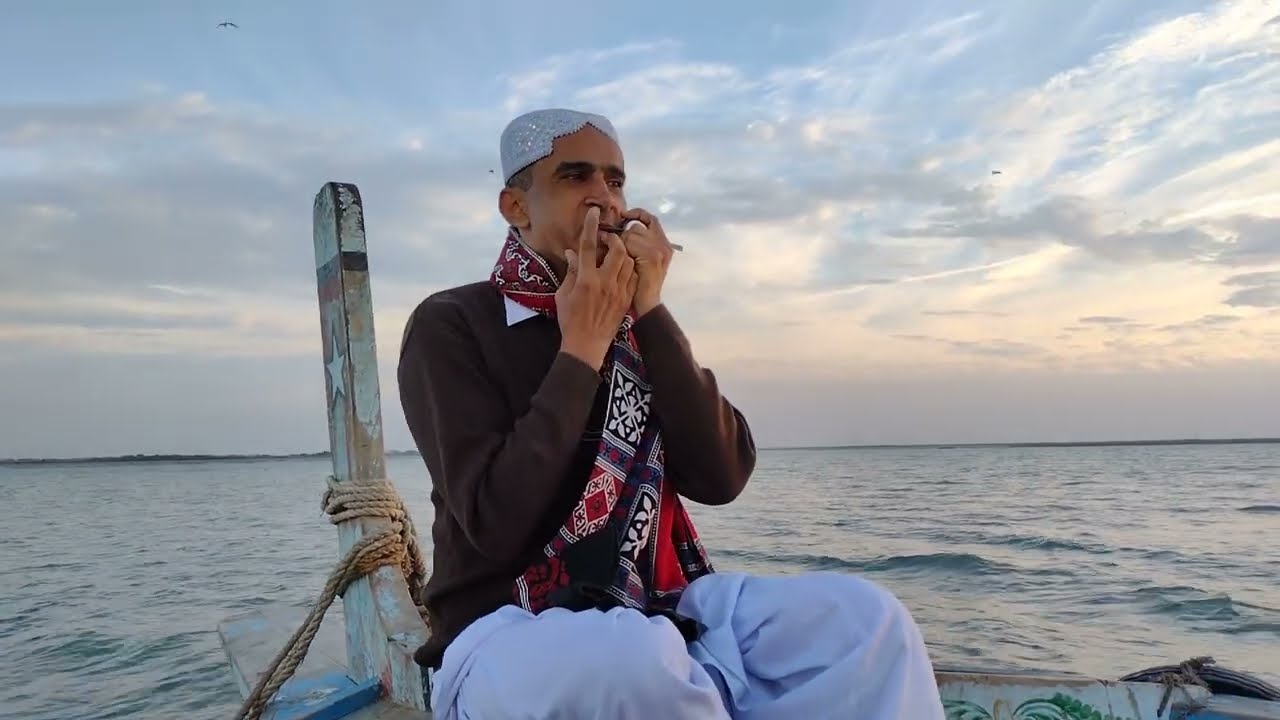 Morchang / Morsing / Chang (Jaws Harp / Jews Harp) on a boat in the Sea, Keti Bandar, Sindh. چنگ ساز