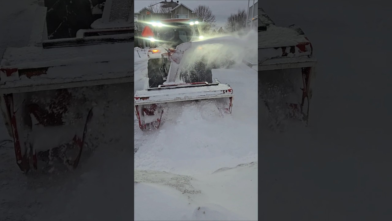Tractor Snow Blower Clearing A February Snow Storm
