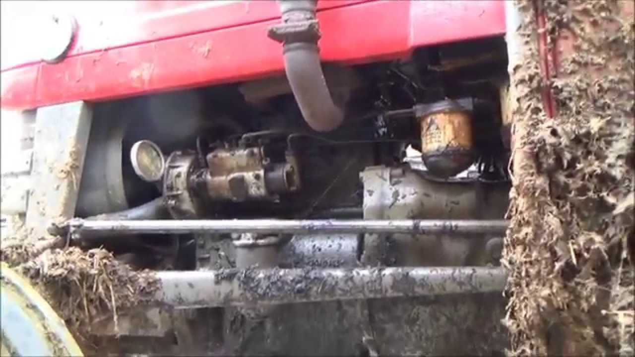 changing the oil filter on a Massey Ferguson 135 tractor