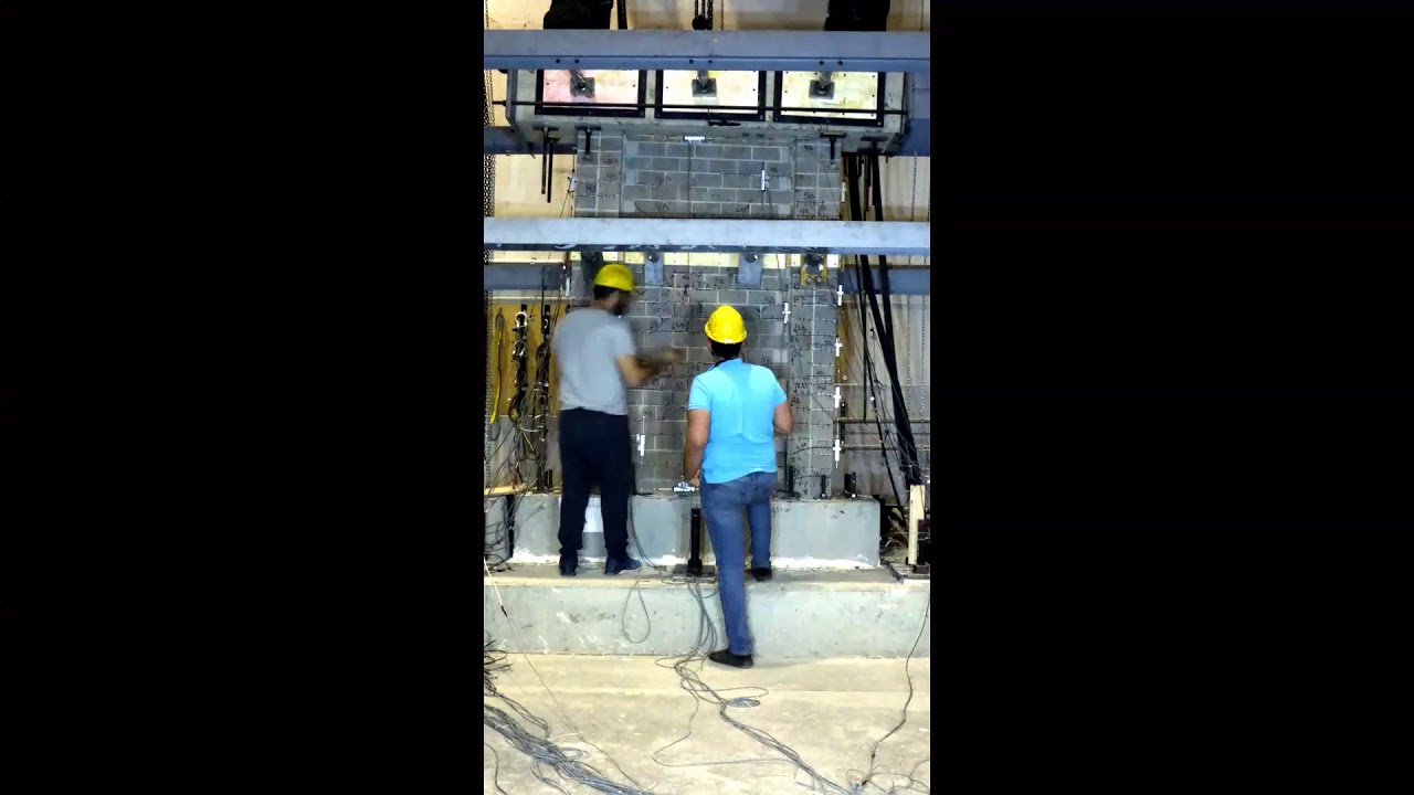 Quasi-static cyclic testing of a high-rise reinforced masonry shear wall with boundary elements
