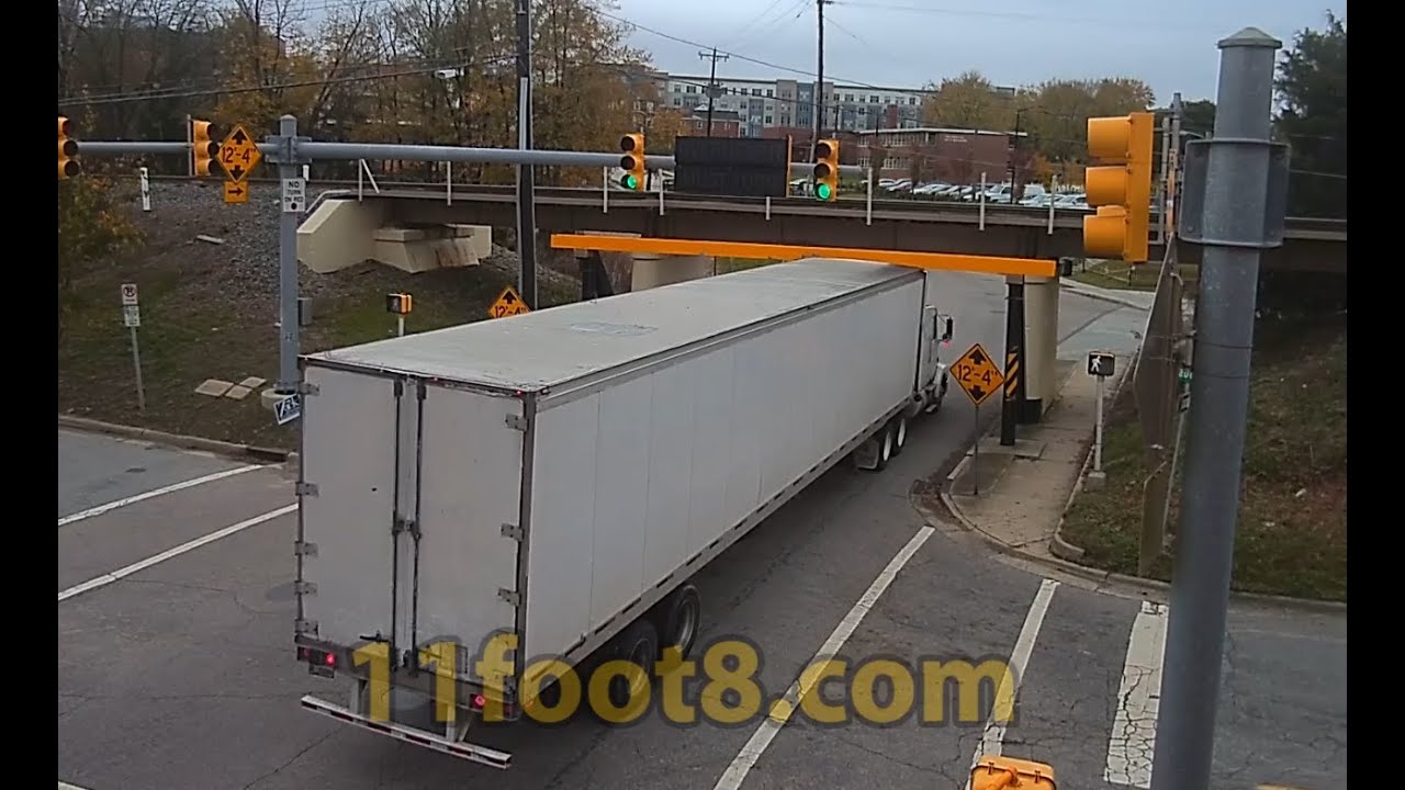 Semi truck gets fairing stuck at the 11foot8+8 bridge