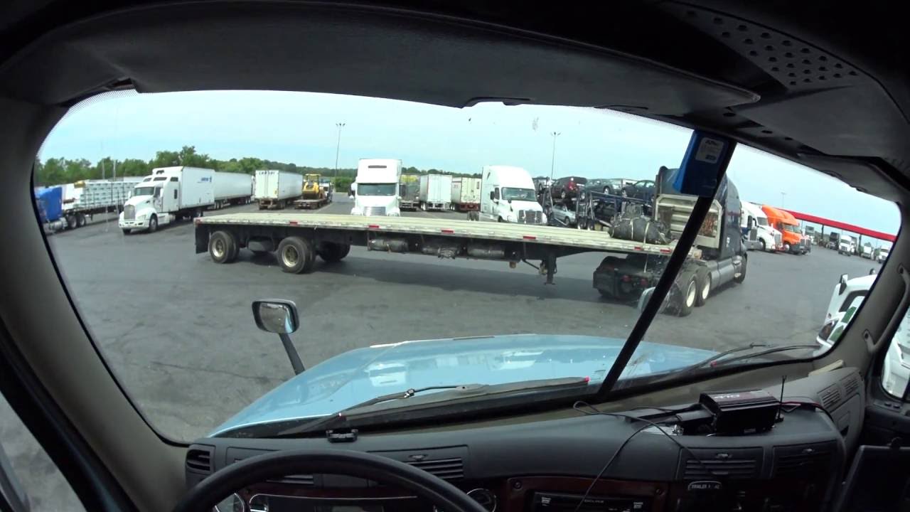 2997 A flatbed backing up at the J