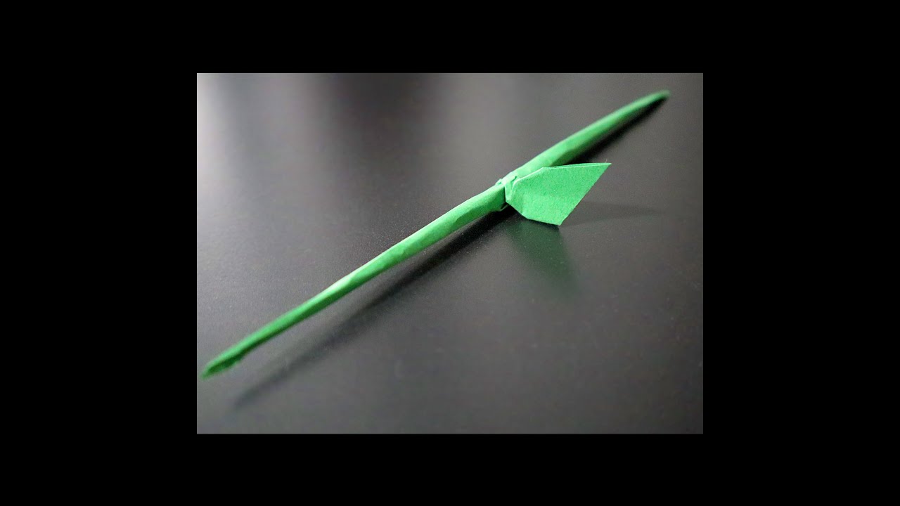 Origami stem and leaf. I created this many moons ago. Single triangle sheet (half a square).