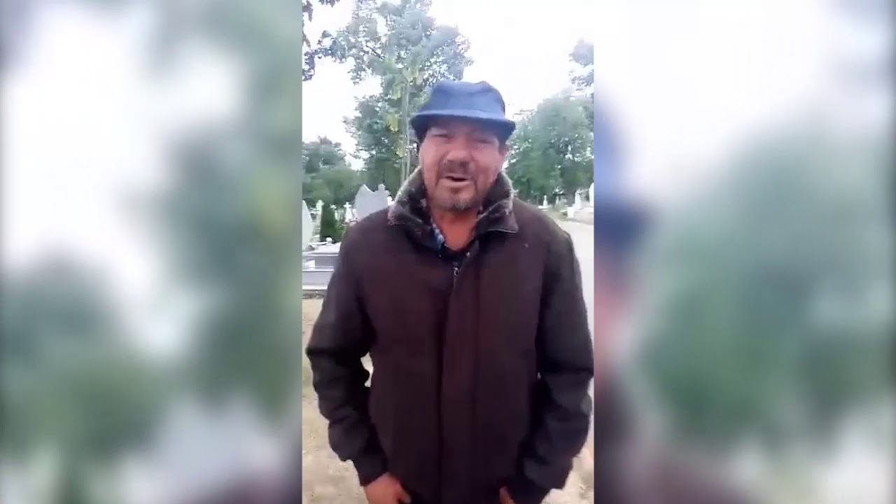 Scandal la cimitirul din Husi: doi b&atilde;rbati dorm noaptea pe morminte!