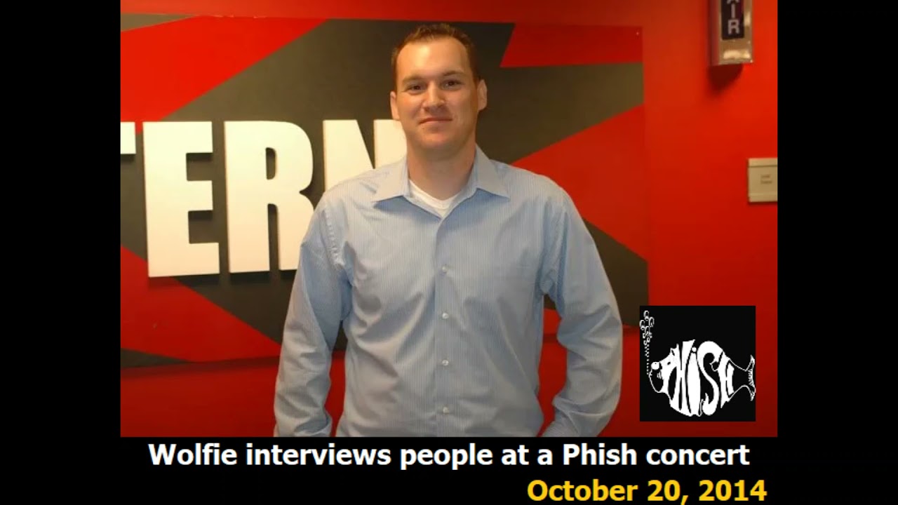 Wolfie interviews people at a Phish concert
