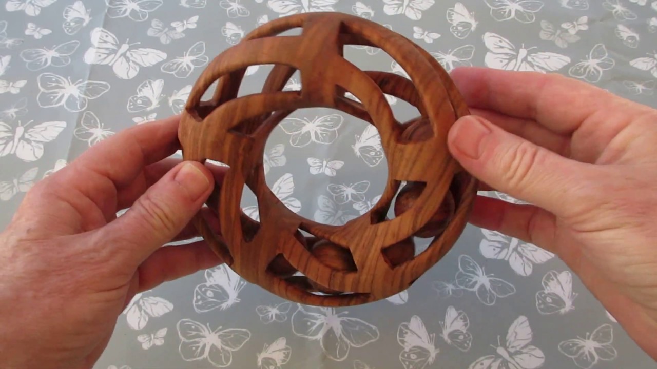 Toroidal ball-in-a-cage design, carved from Xylia (Zambezi ash)