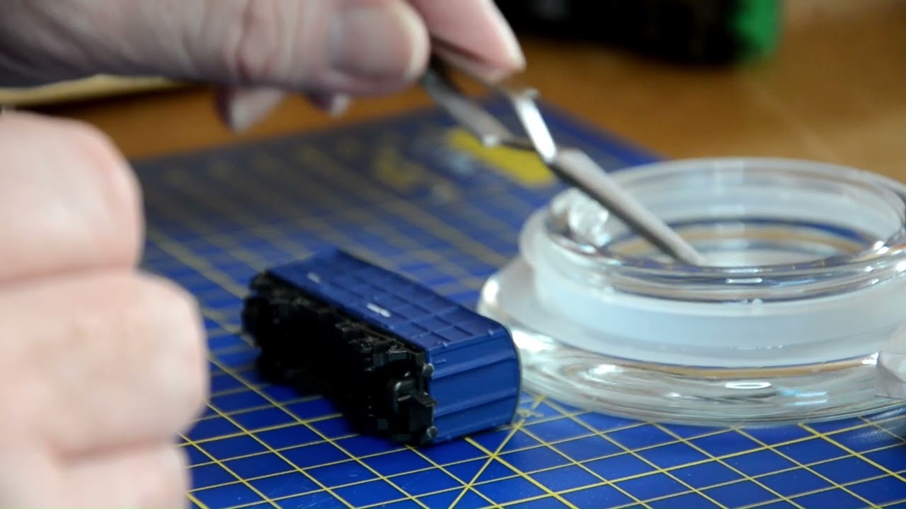 Applying some Railtec transfers to an N gauge Pallet van.