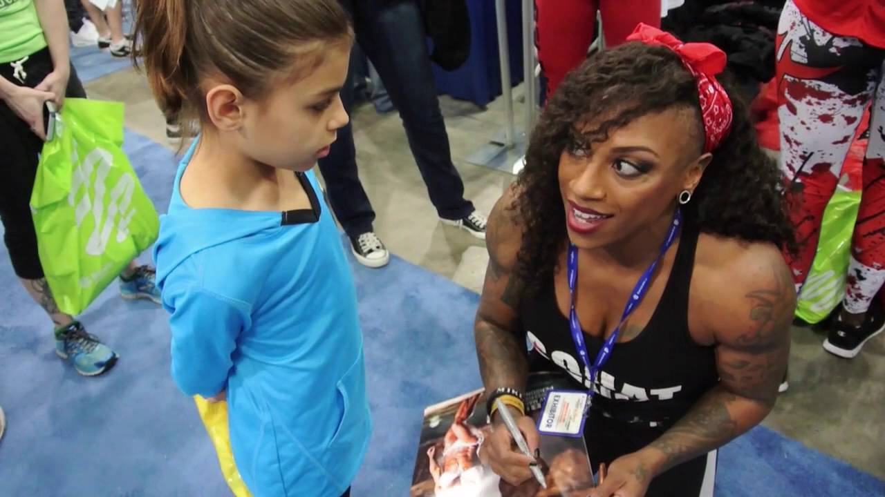 THE LA FIT EXPO  FLEXING BICEPS AND KISSING BABIES-IFBB PRO TWANA FERGUSON