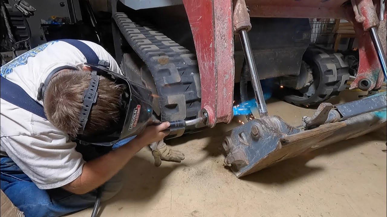 replacing pins and bushings and track adjustment pin on Takeuchi tl8