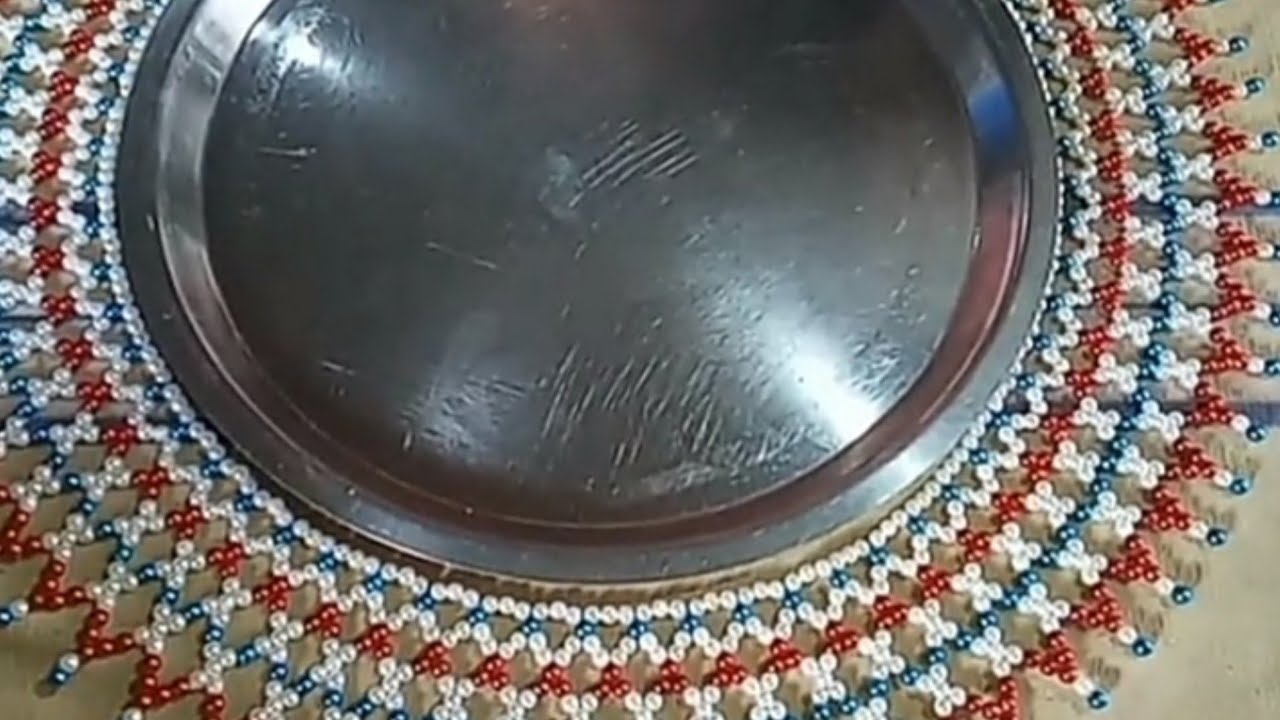 मोत्याची ताटा भवतीची महिरप रांगोळी (moti decoration)