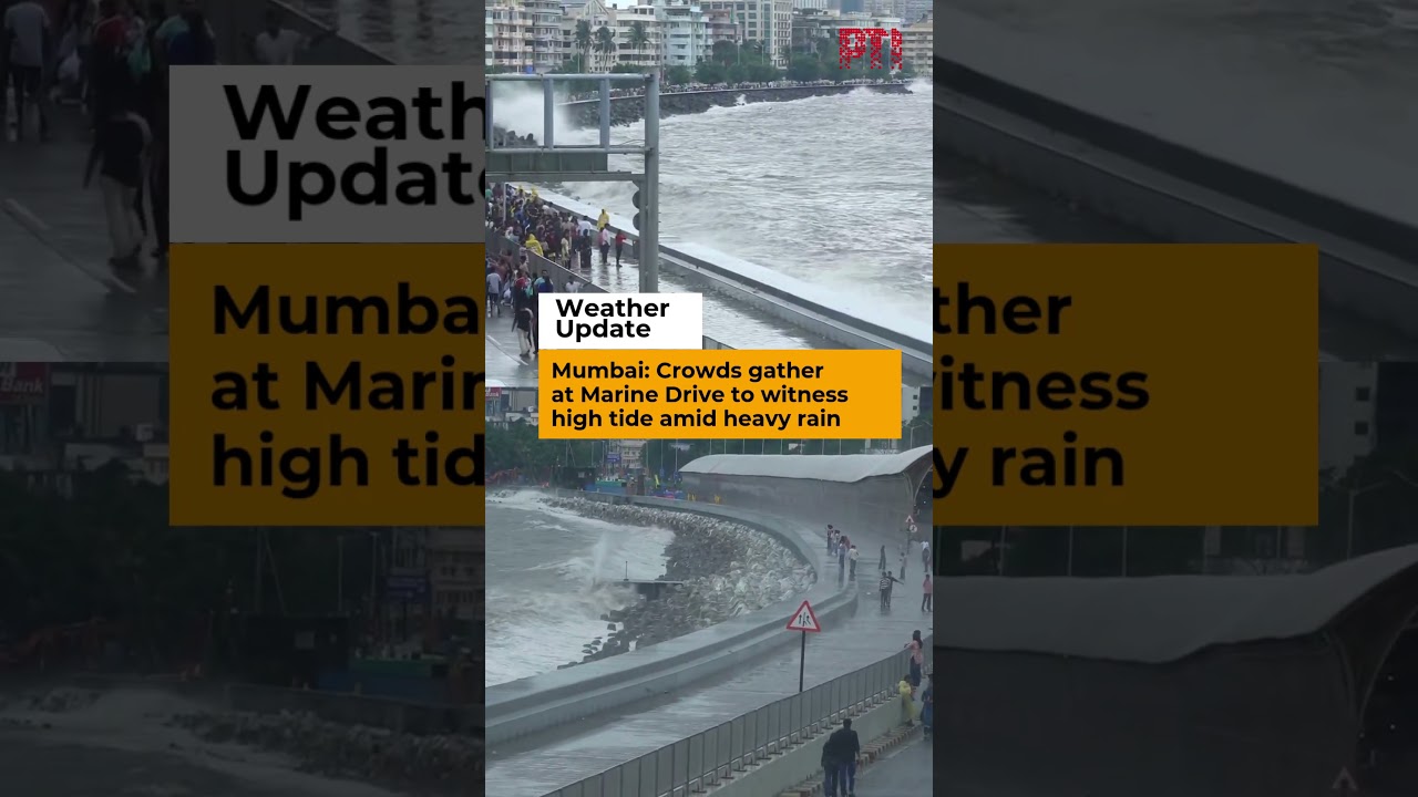 Mumbai: Crowds gather at Marine Drive to witness high tide amid heavy rain