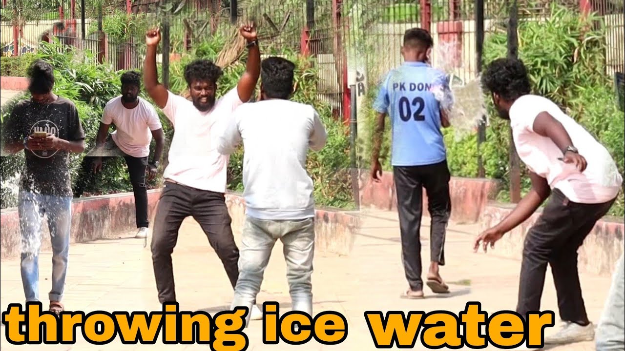 throwing ice water balloons at people prank||