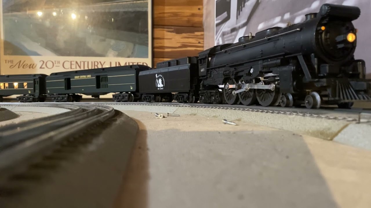 1956 Lionel 665 locomotive with 2003 Railsounds tender and Jersey Central passenger cars