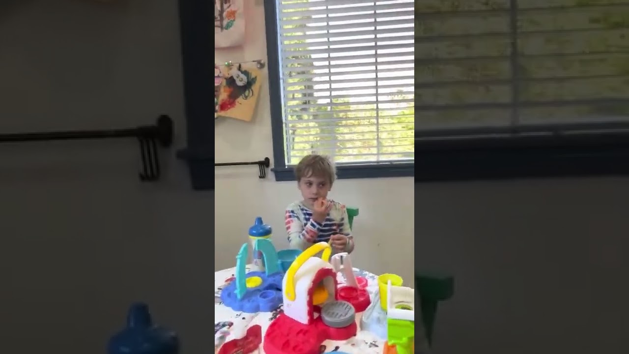 Sister coaches her little brother before school starts.