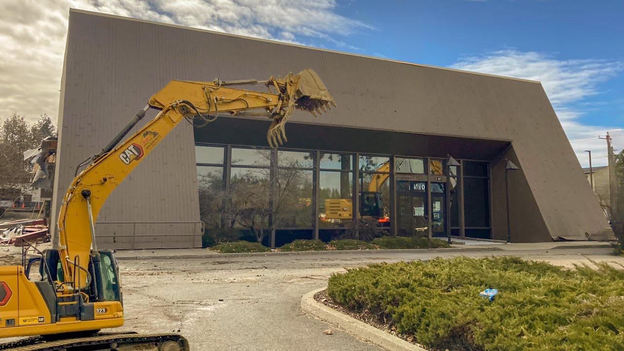 Demolishing a Huge Bank with a Caterpillar Excavator
