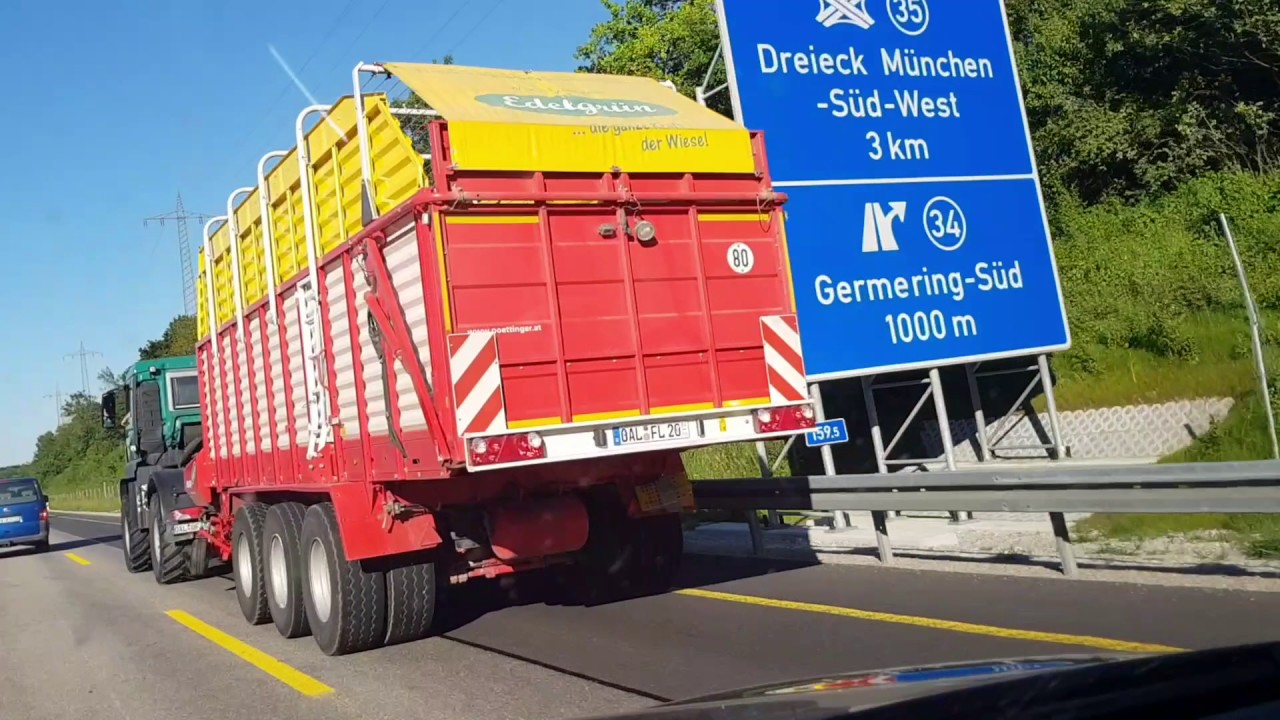 MAN mit 4-Achs P&ouml;ttinger Ladewagen auf der Autobahn