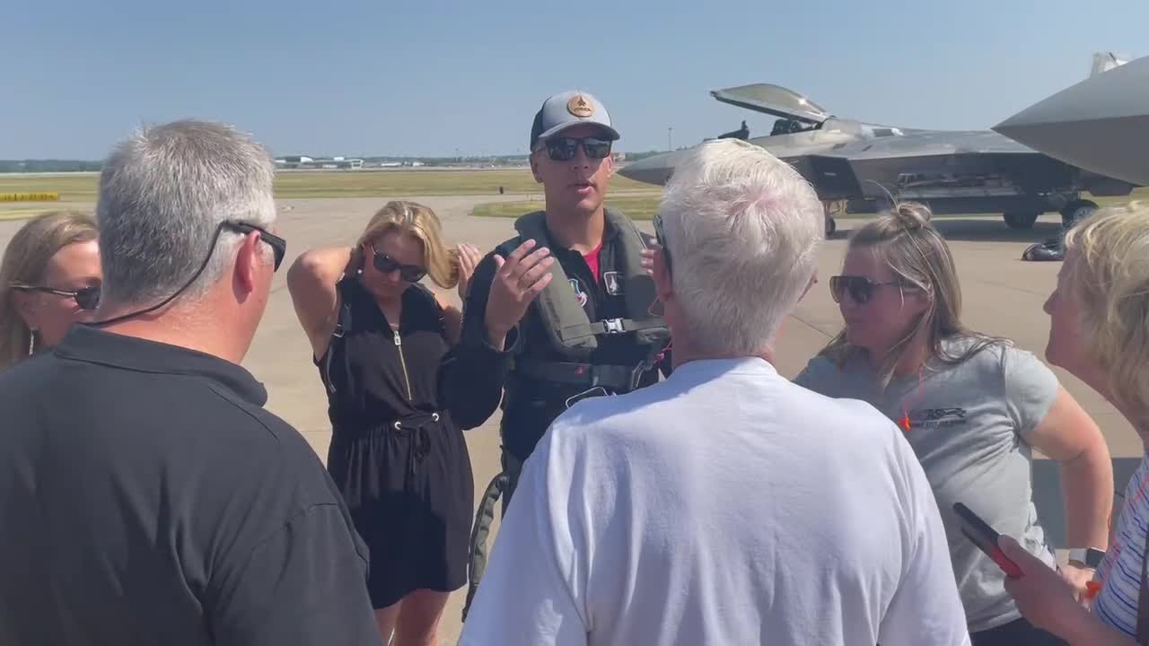 Davenport resident Sam Larson greeted by family and friends after landing his F-22 Raptor at QC