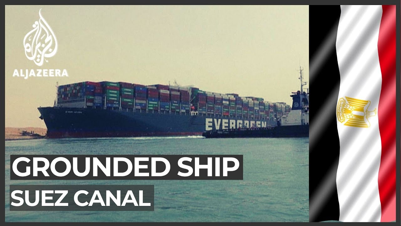 Suez Canal suspends traffic as tug boats work to free ship