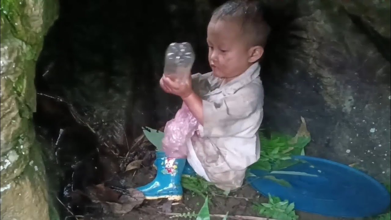The poor orphan boy had to go into a cave to take shelter from the rain alone.