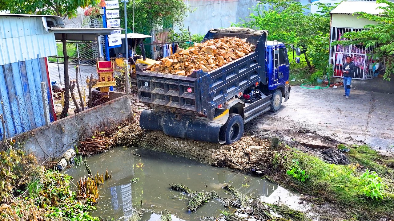 excellent nice project landfill building house , truck transport with bulldozer push soil to water