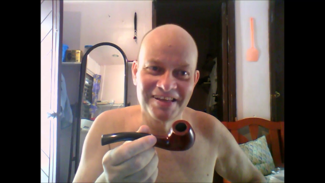Smoking a pipe with cut dry tobacco, all natural, in Davao del Sur, Philippines