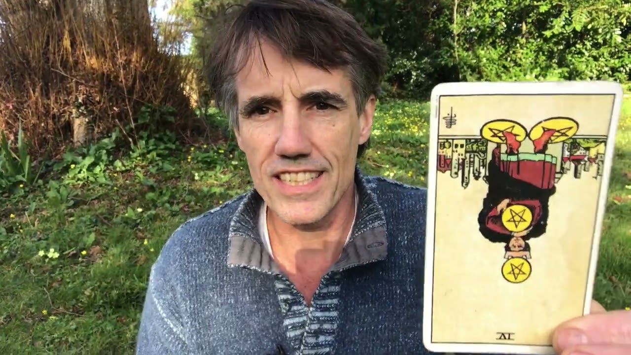 Four of Pentacles reversed tarot card meaning