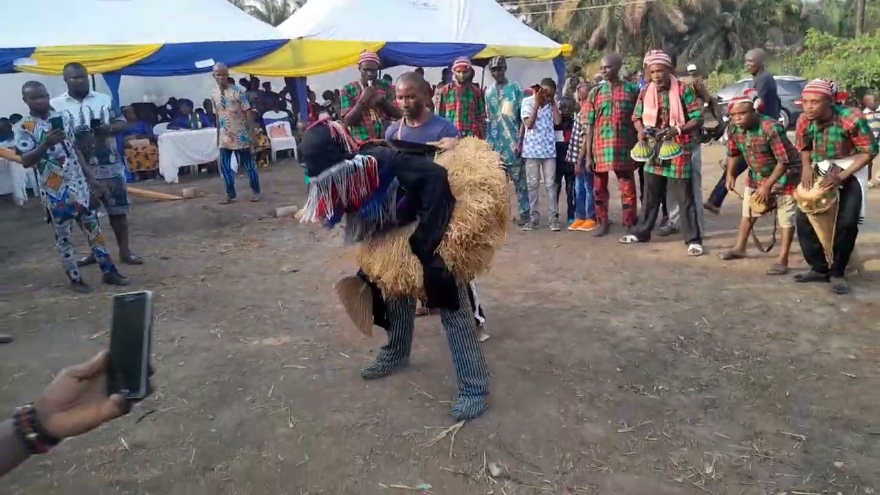 Ojionu MASQUERADE  GREETING  SPECTATORS AT A CELEMONY