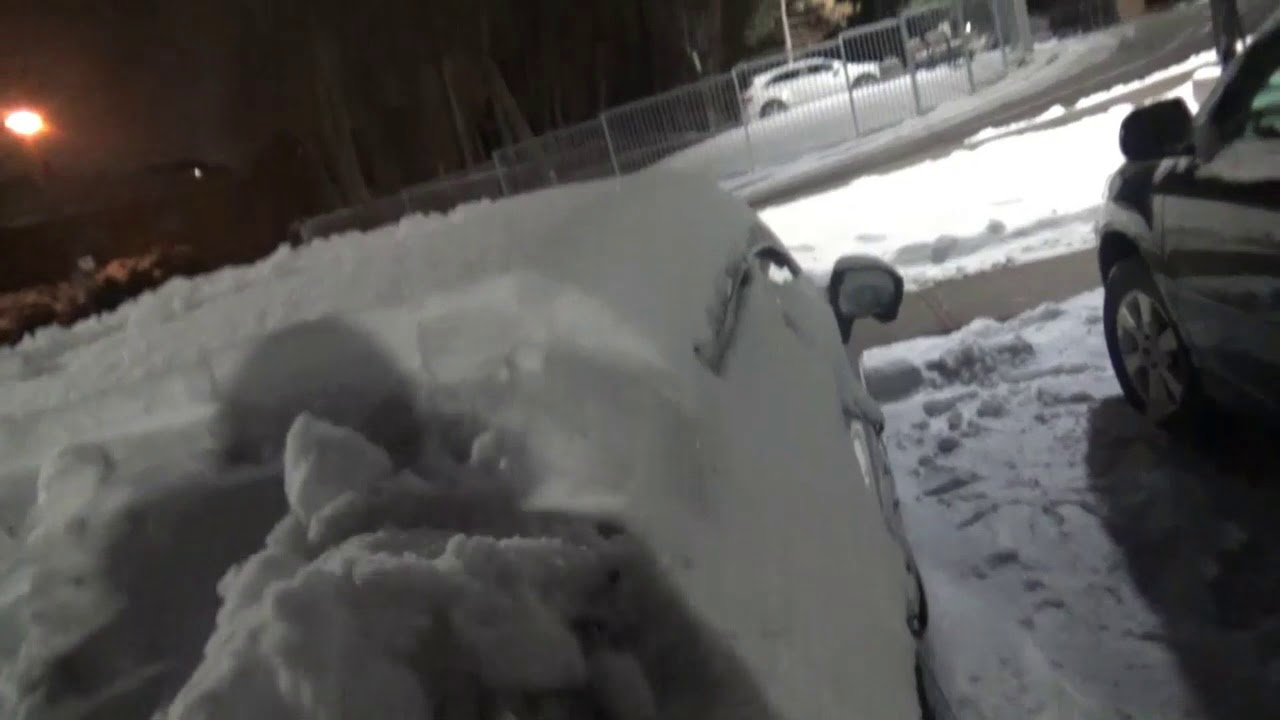 My frozen Car Clearing Snow Off my Car