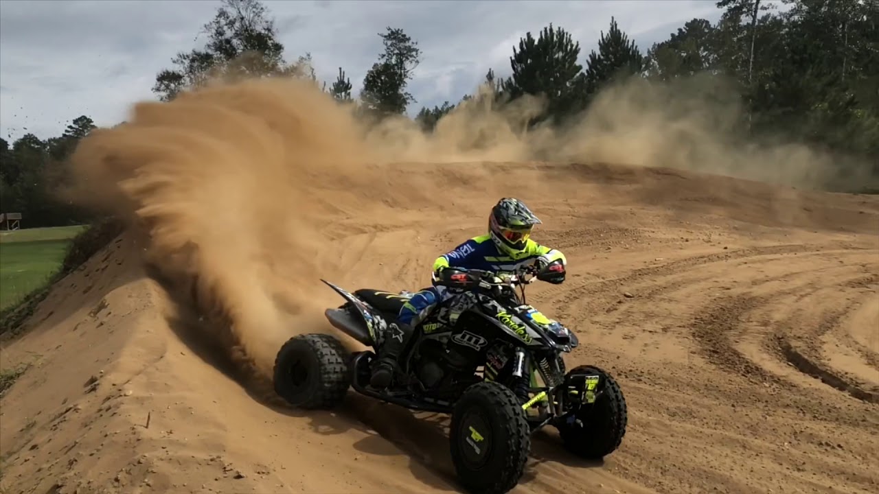 TRX450r jumps, whoops, cornering and racing clips.