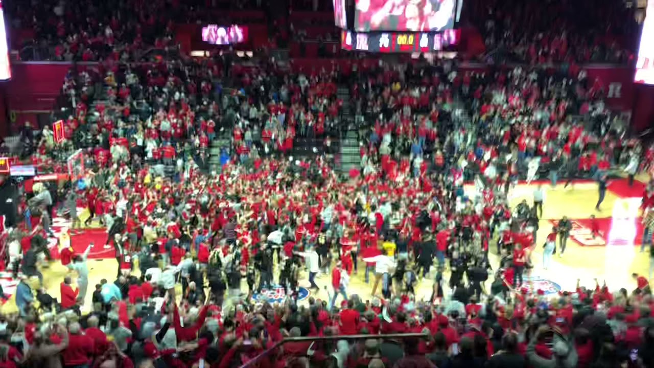 Rutgers fans rushing the court after buzzer beater over #1 Purdue