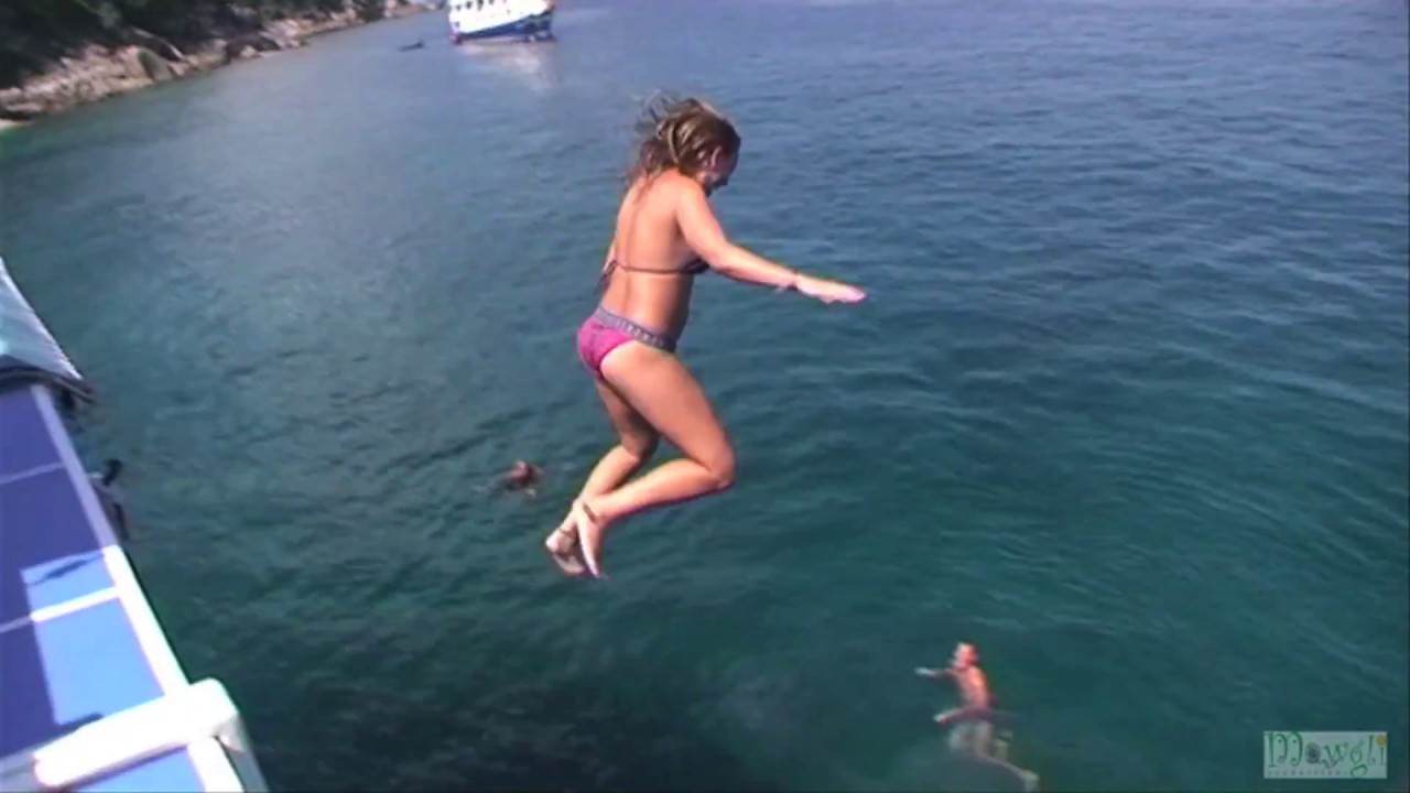 Girls Jumping into The Sea Fun Loving Adventure People