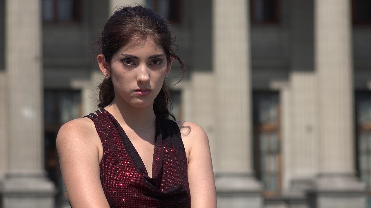 Serious Confused Woman At Library Or Courthouse